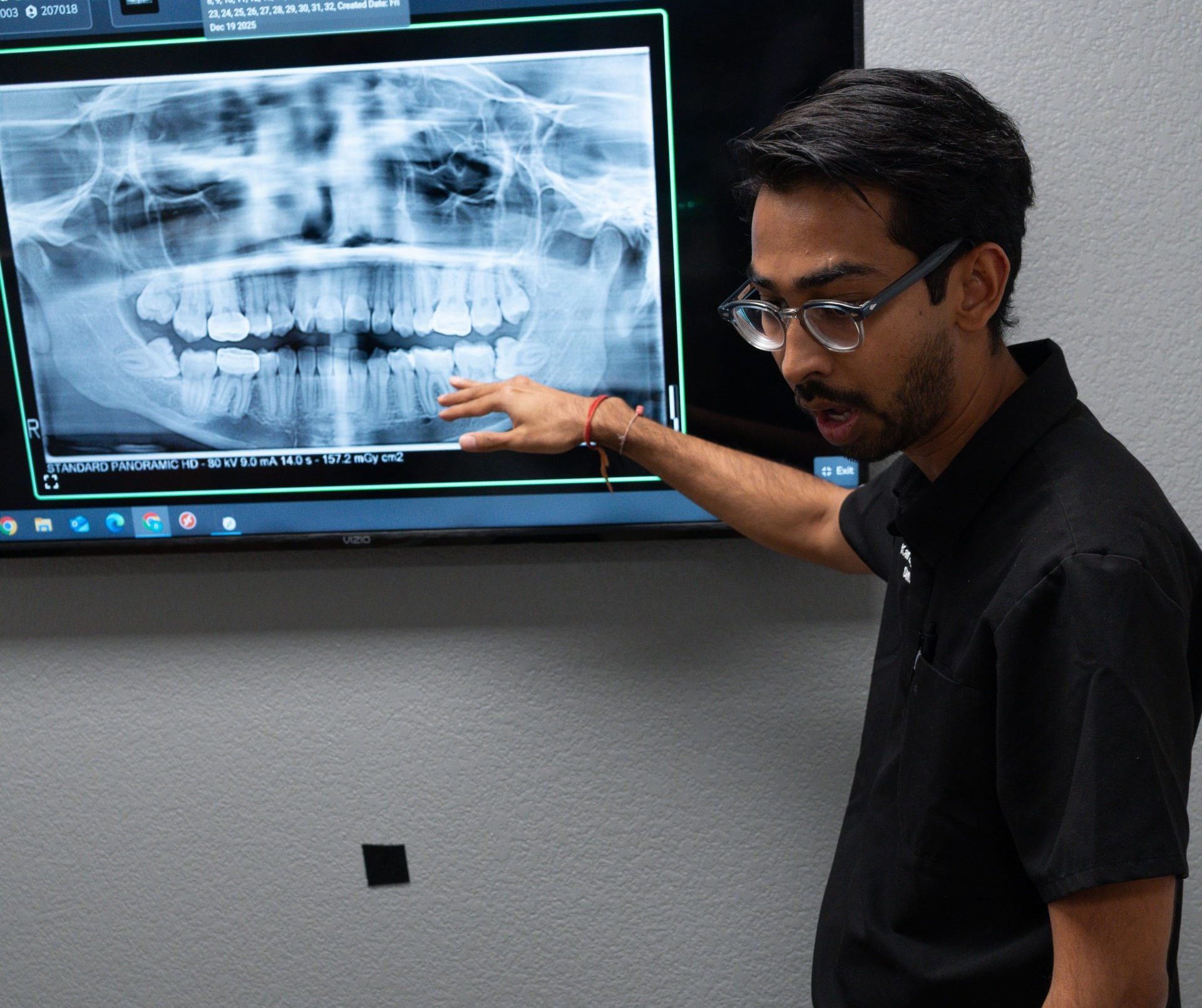 Dr. Shah Reviewing Dental X-Ray With Patient